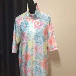 Floral print with high collar and zipper.